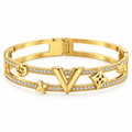Bracelet Rigide Double Lignes Cristaux Pendentifs V Trèfles Luxe