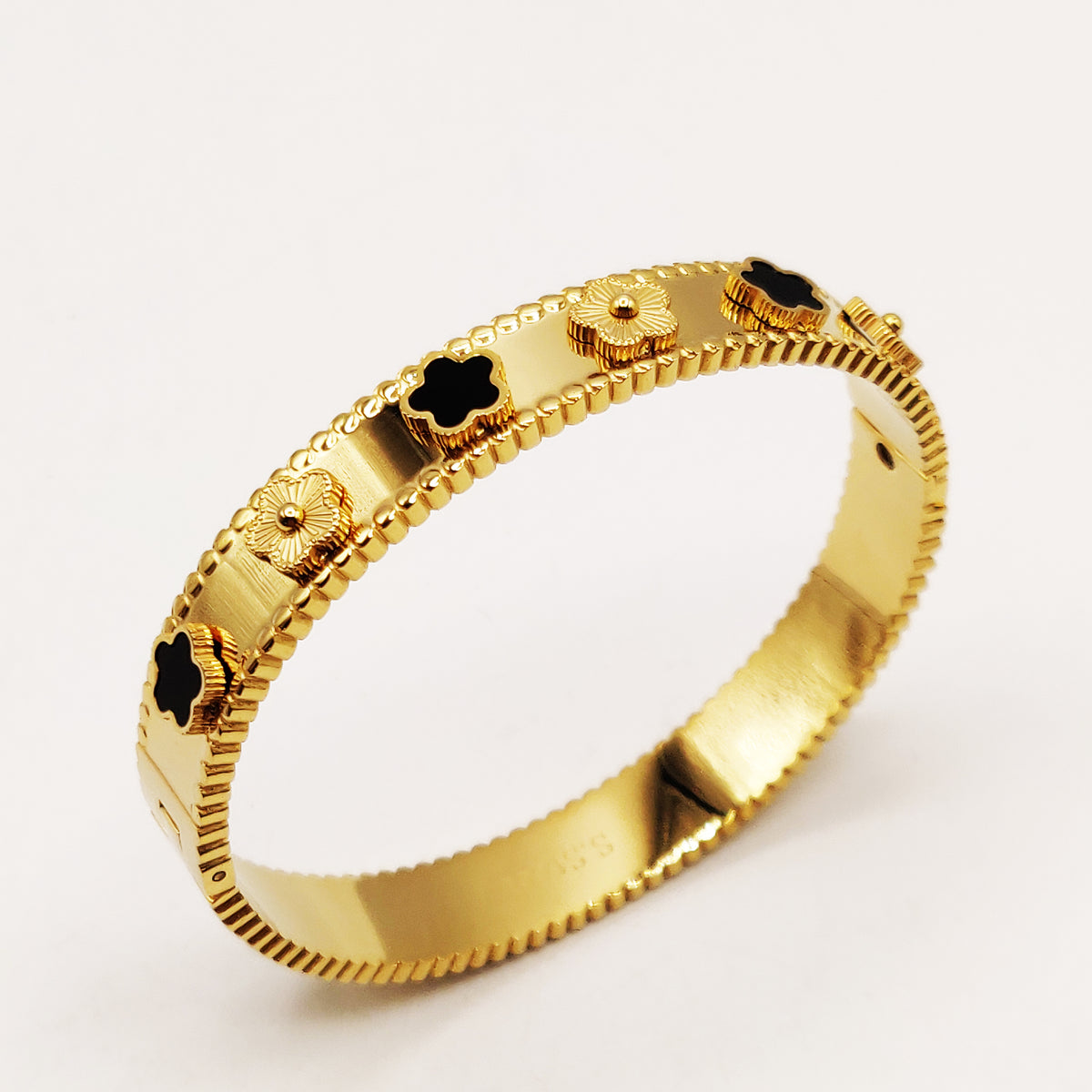 Bracelet Rigide Marguerites Dorées et Noires Luxe