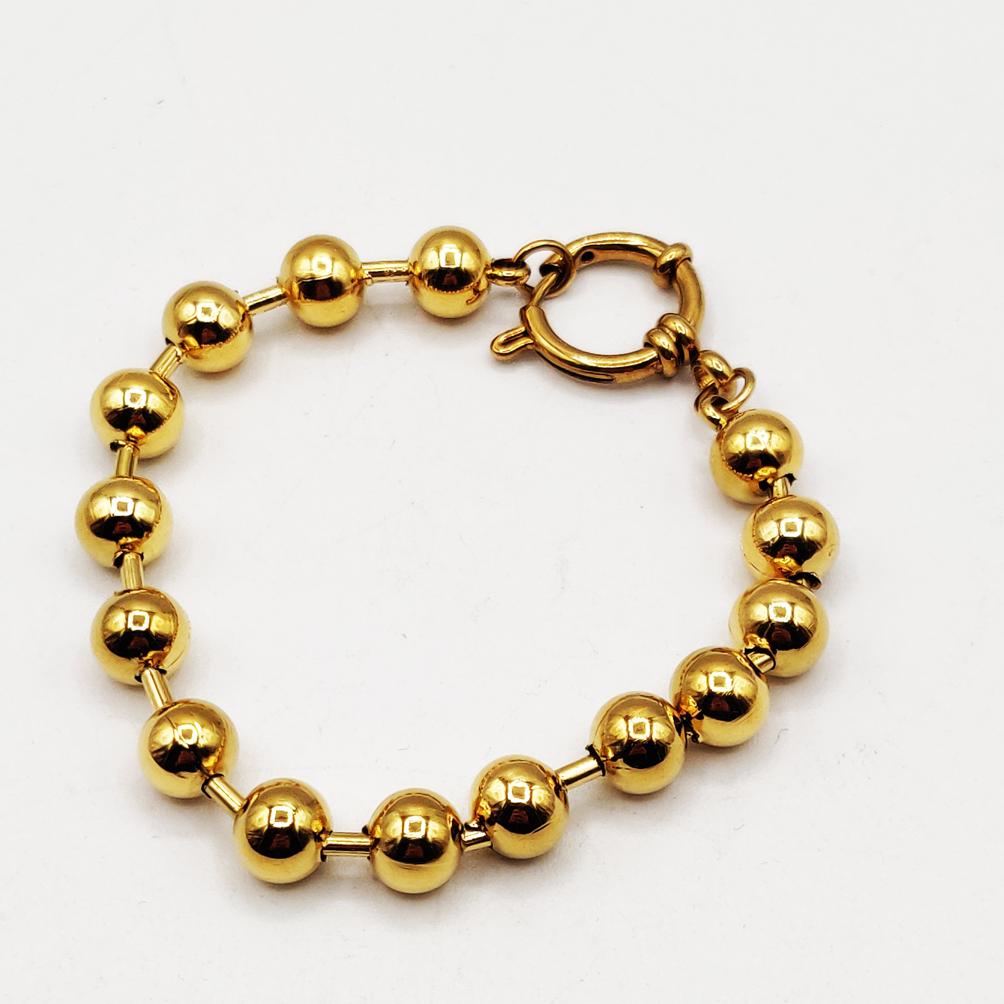Bracelet Grosses Perles d'imitation Dorées et Cercle Luxe