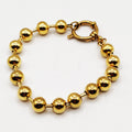 Bracelet Grosses Perles d'imitation Dorées et Cercle Luxe