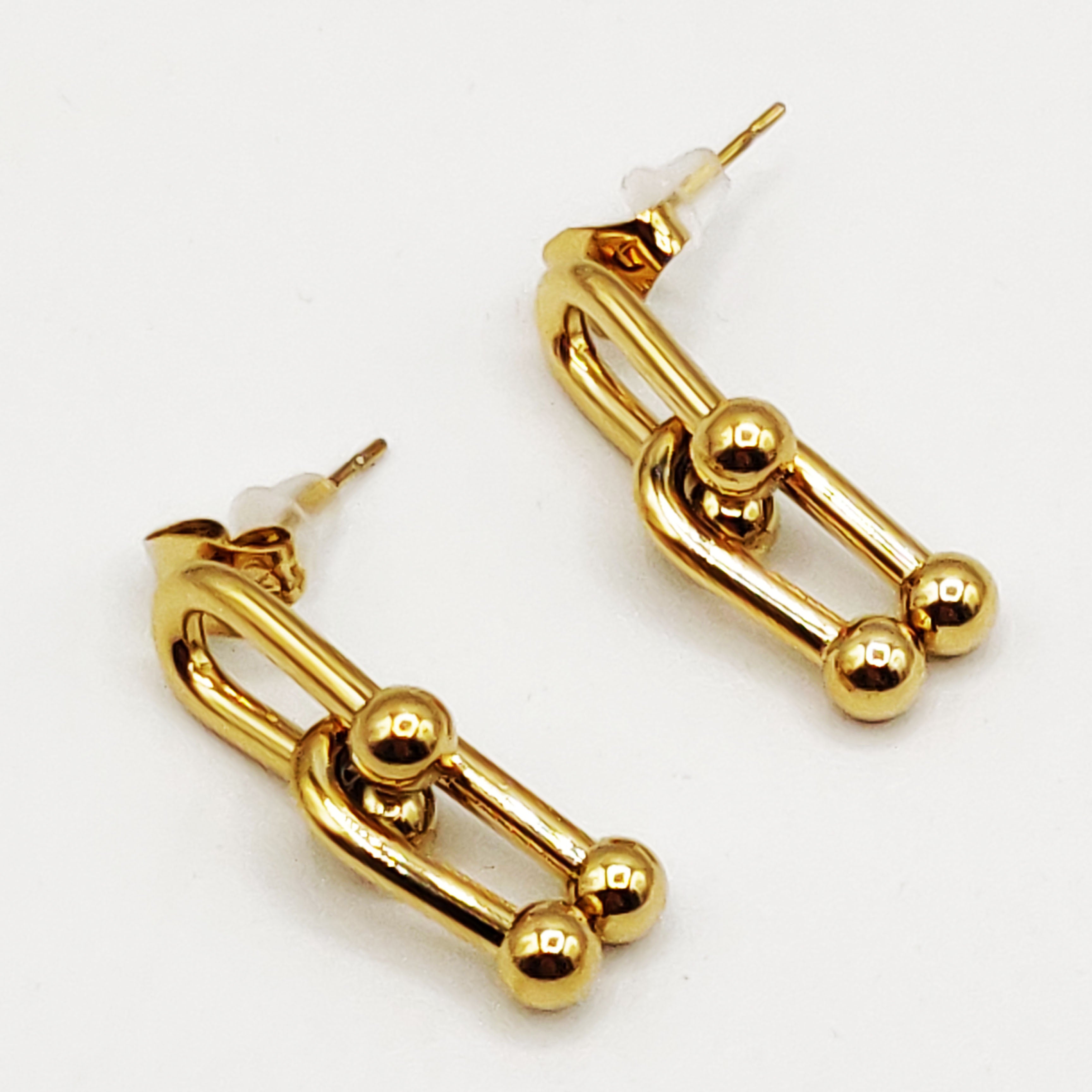 Boucles d'oreilles T Luxe