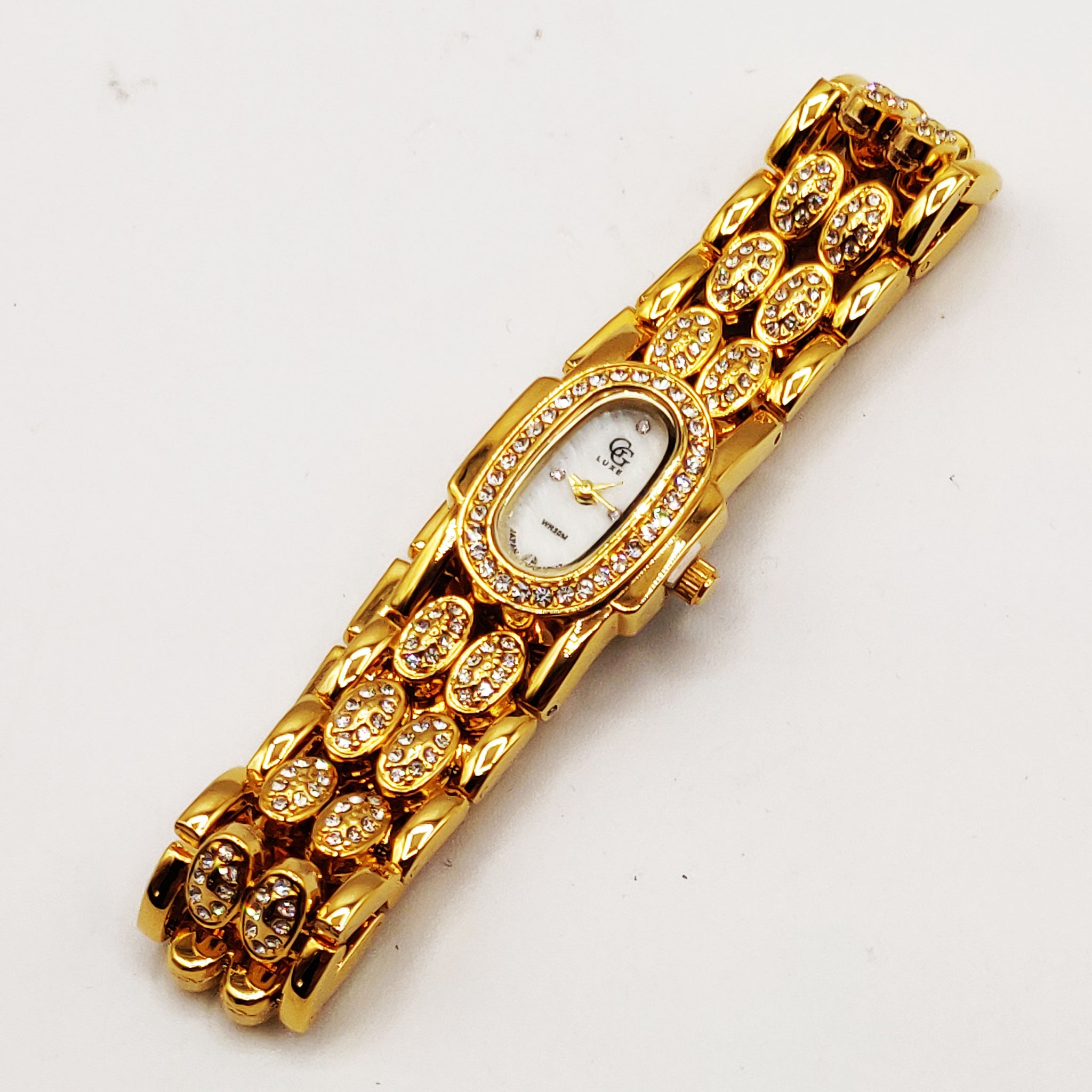 Montre GG Luxe FA1729 Bracelet Doré Fond Blanc