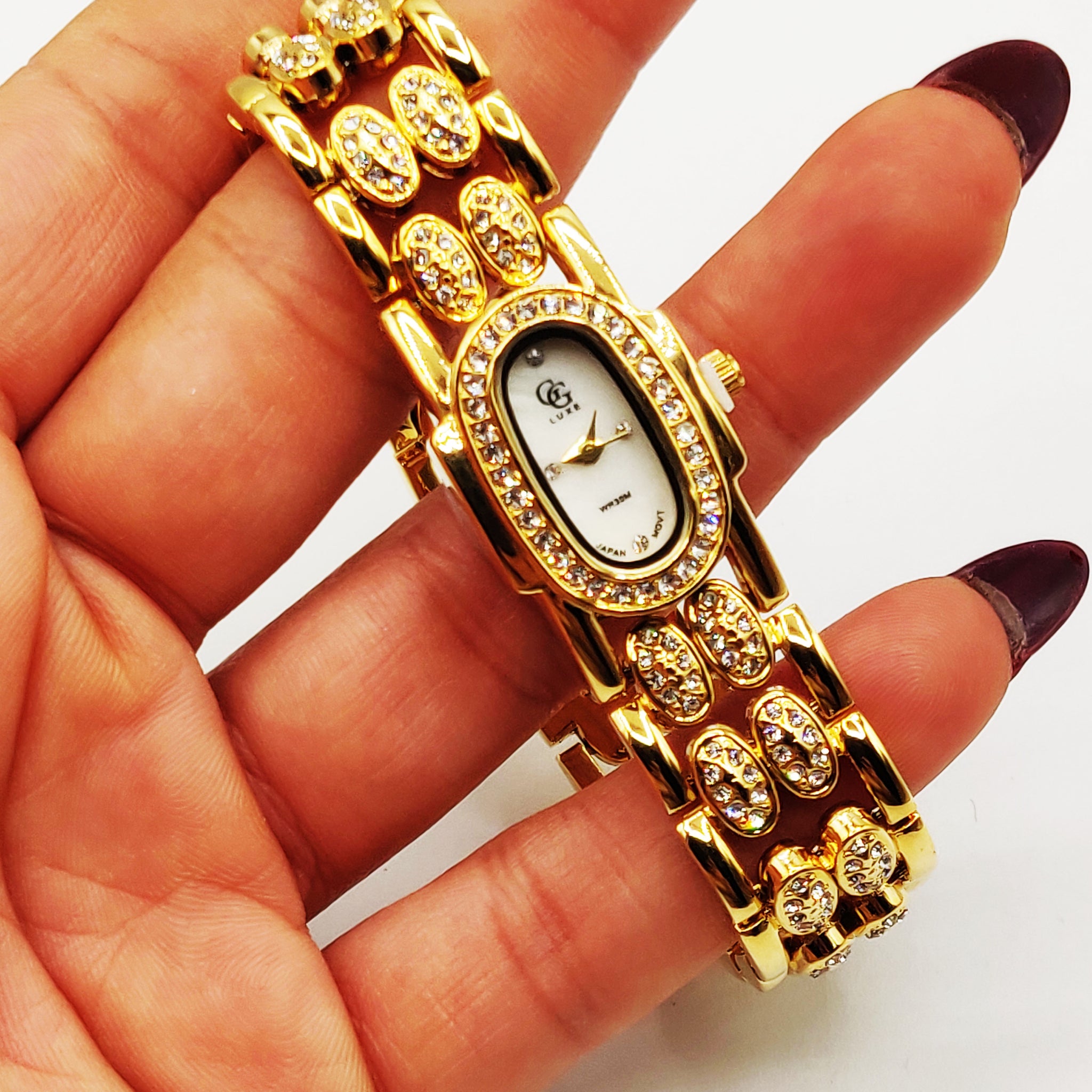 Montre GG Luxe FA1729 Bracelet Doré Fond Blanc