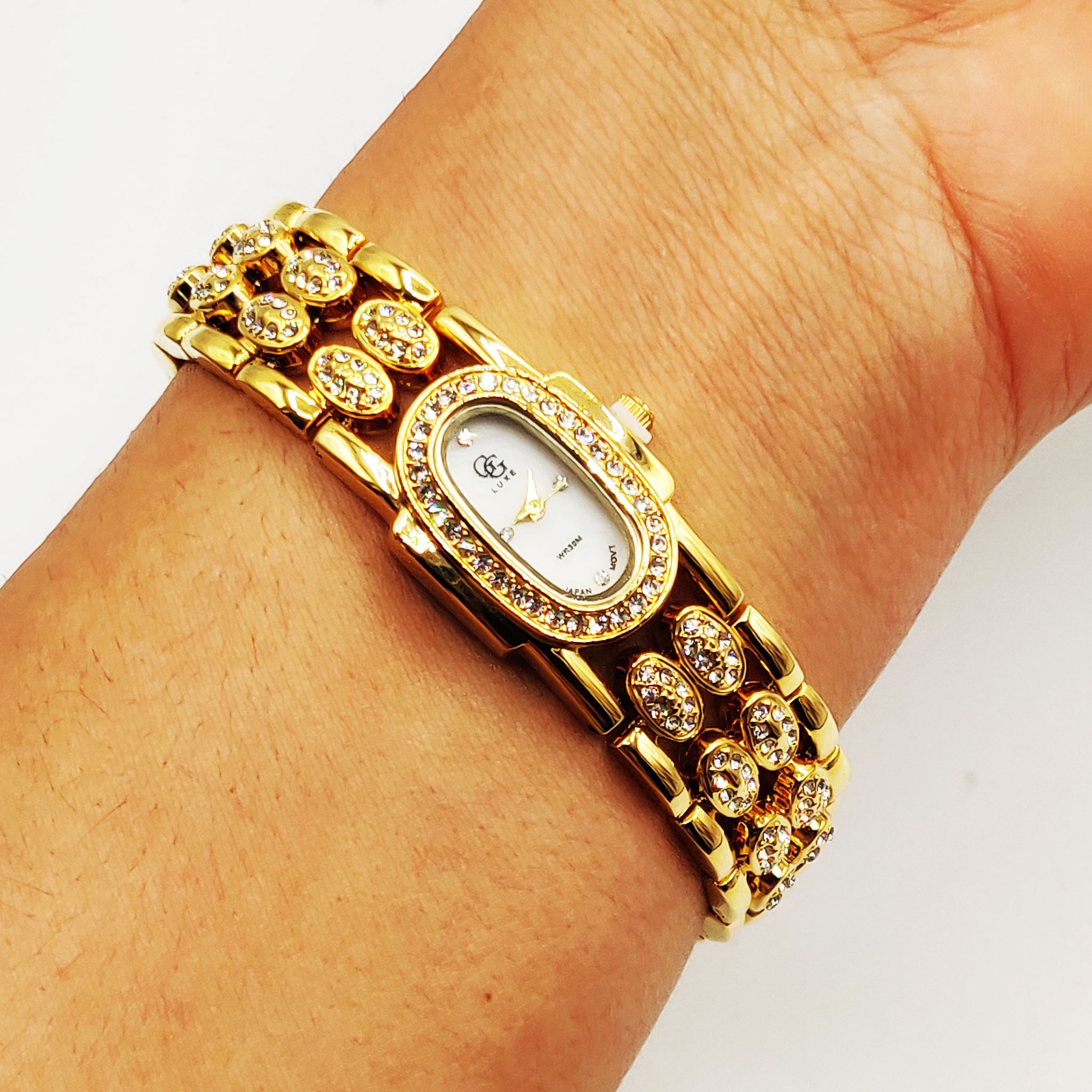 Montre GG Luxe FA1729 Bracelet Doré Fond Blanc