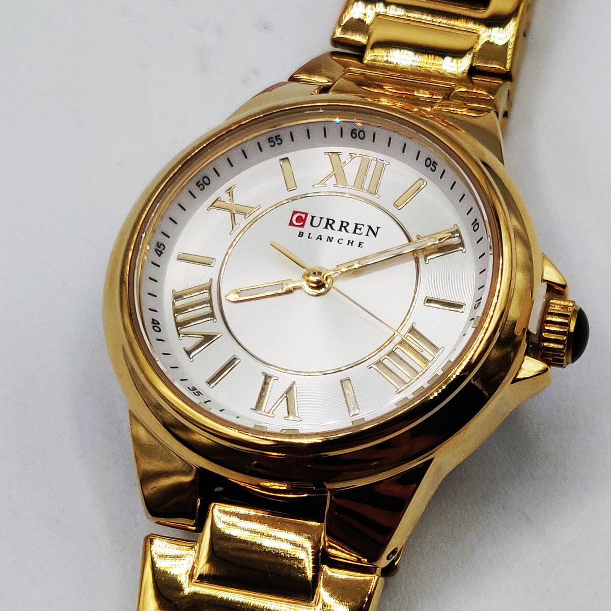 Montre Curren C9091L Bracelet Doré Fond Blanc