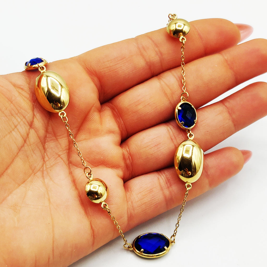 Collier Ovales Dorés et Cristaux Bleus Luxe