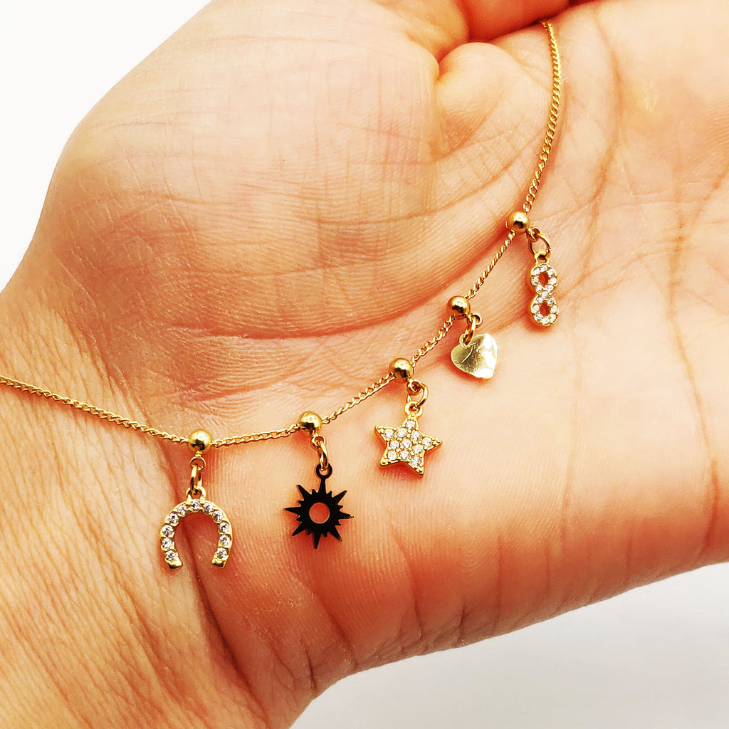 Bracelet Perles d'imitation Dorées Multi Pendentifs Étoile Cristaux Luxe