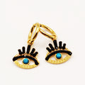 Boucles d'oreilles Yeux Cristaux Noirs et Perles Bleues
