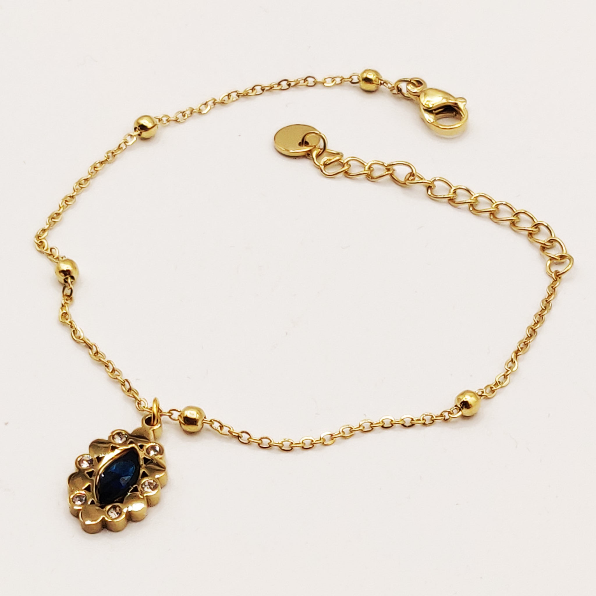 Bracelet Multi Perles Dorées et Cristal Bleu Ovale Luxe
