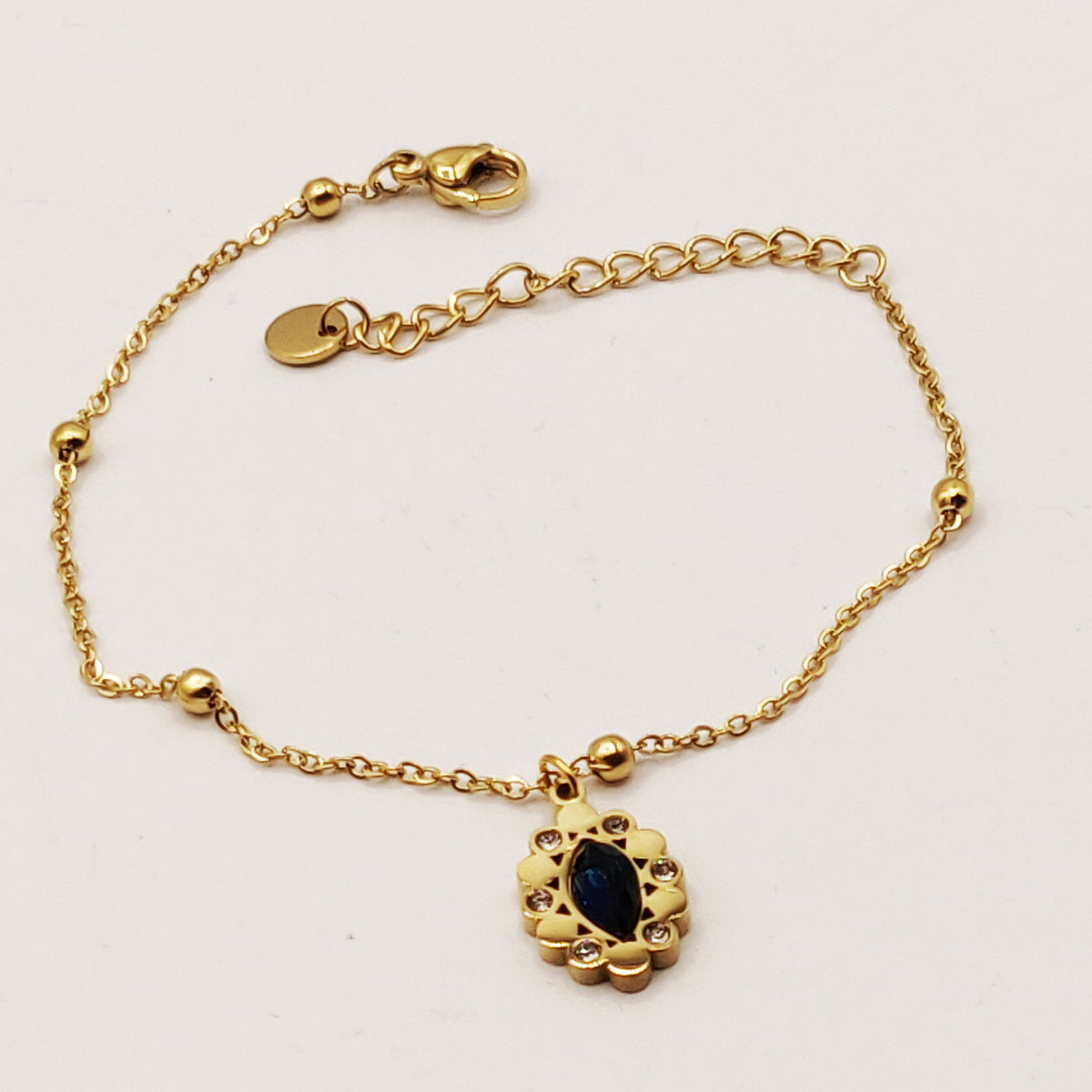 Bracelet Multi Perles Dorées et Cristal Bleu Ovale Luxe