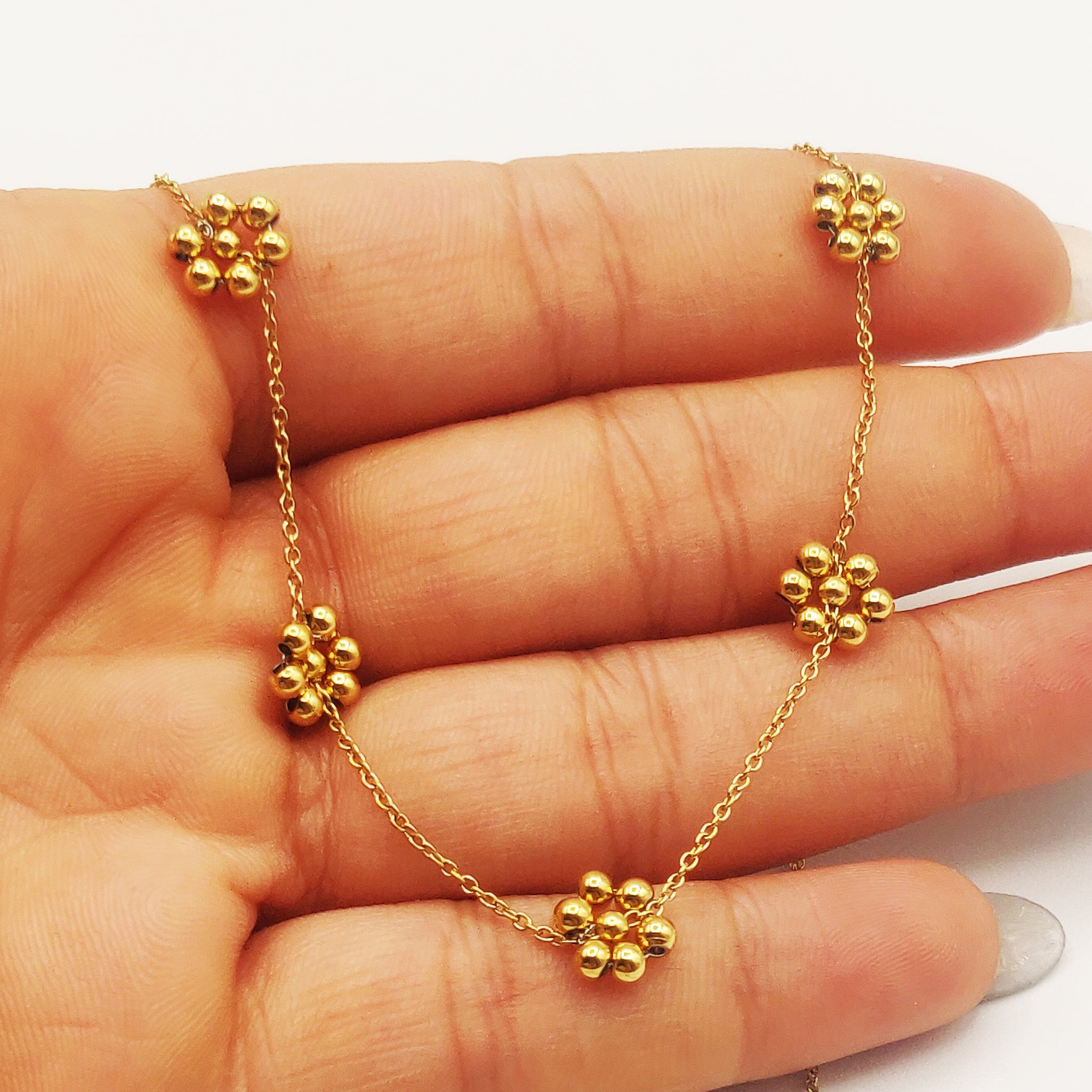 Collier Fleurs en Perles Dorées