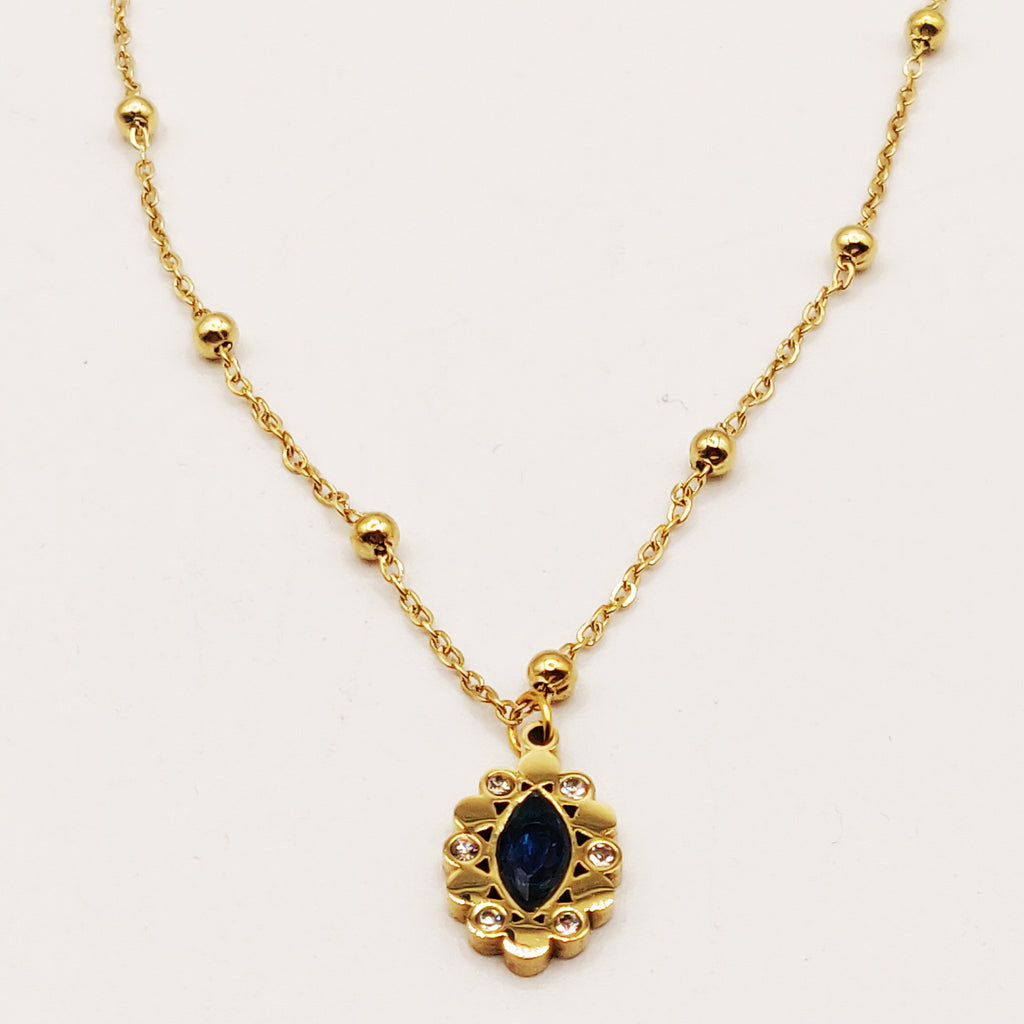 Collier Multi Perles Dorées et Cristal Bleu Ovale Luxe