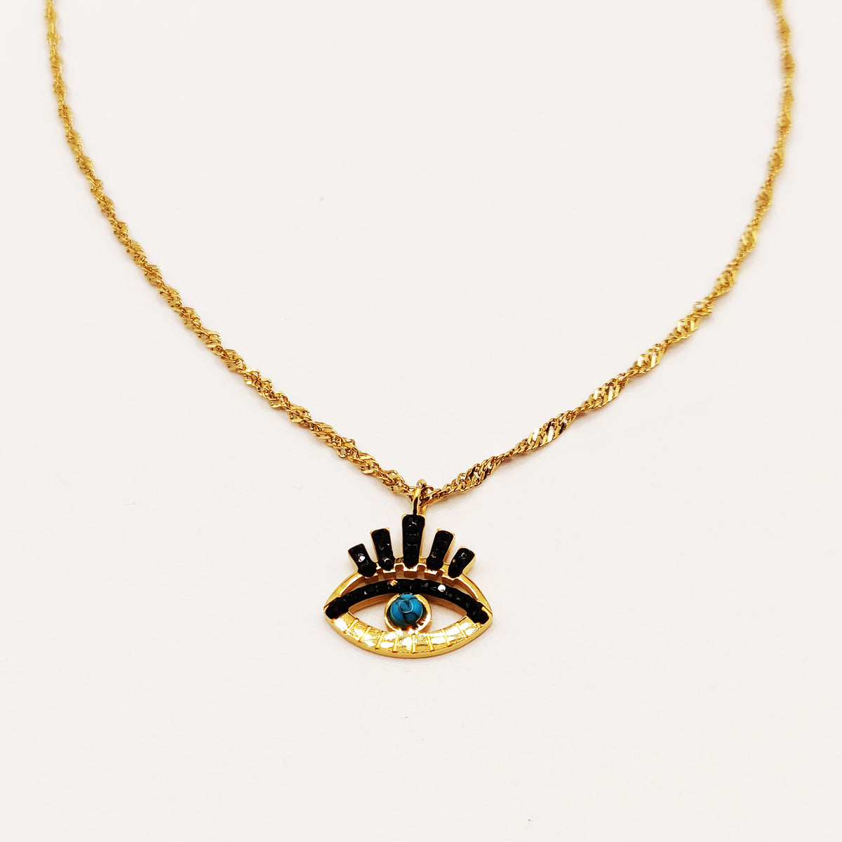 Collier Oeil Cristaux Noirs et Perle Bleue