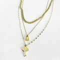 Collier Triple Cadenas et Clé Simple