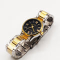 Montre EU4558 Fond Noir Bracelet Argenté et Doré